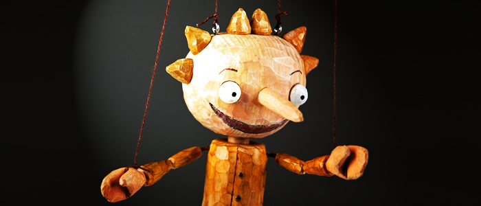 happy wooden marionette puppet